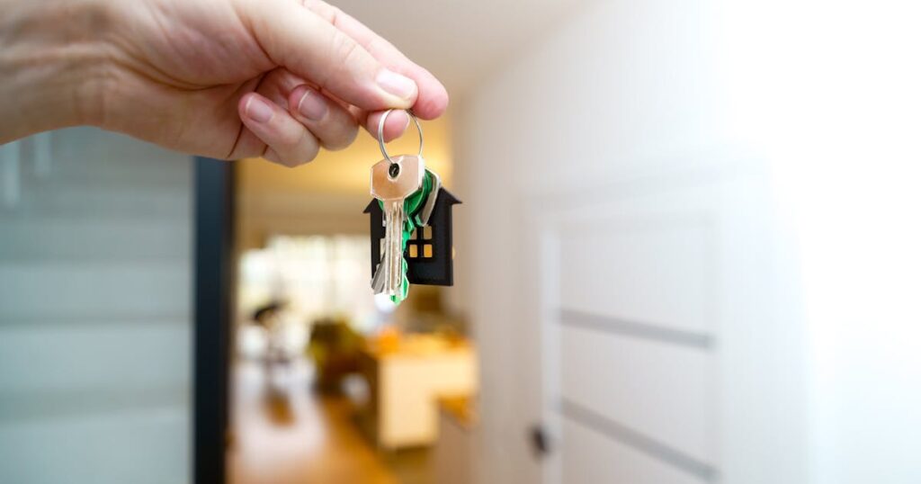 Holding house keys in new home